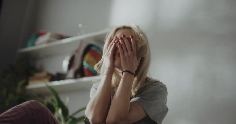 Young woman is laying in bed