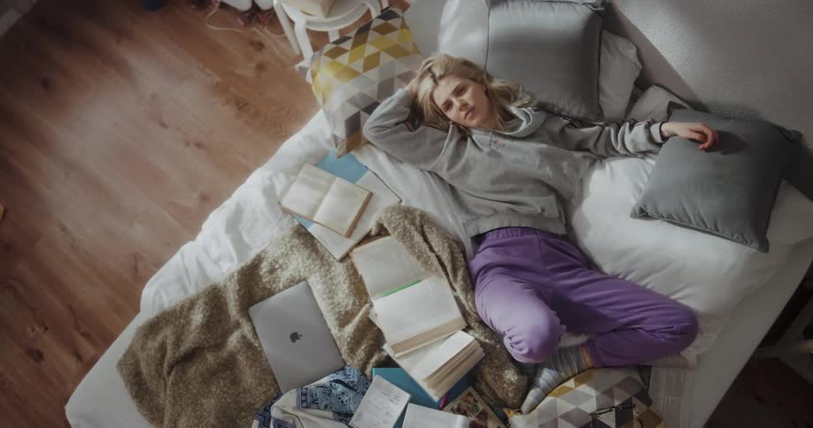 A woman is resting in bed