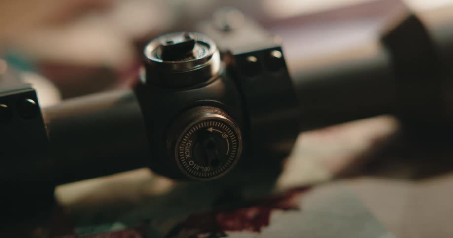 A view of a gun scope on a desk