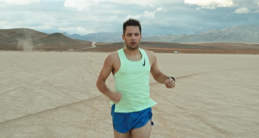 Man is jogging at the desert