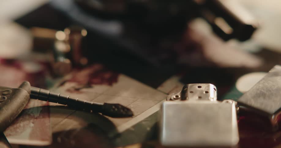 A gun is sitting near the lighter