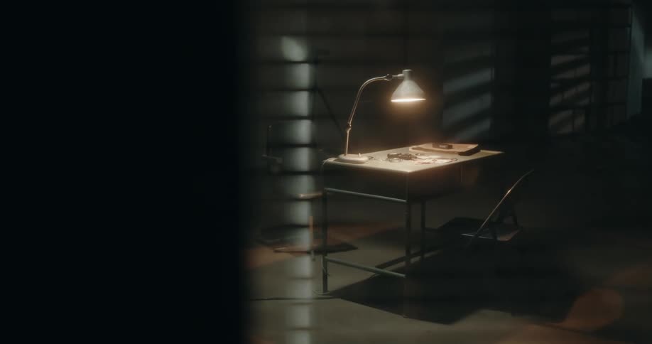 The dark room has a single table