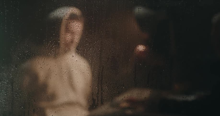 Officer can be seen interrogating suspect through window covered in condensation