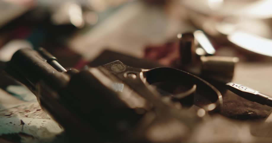 A gun with bullets is on the table