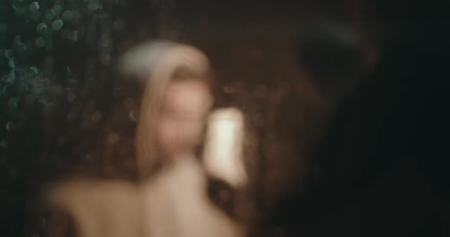 A man is being yelled at in the dark room