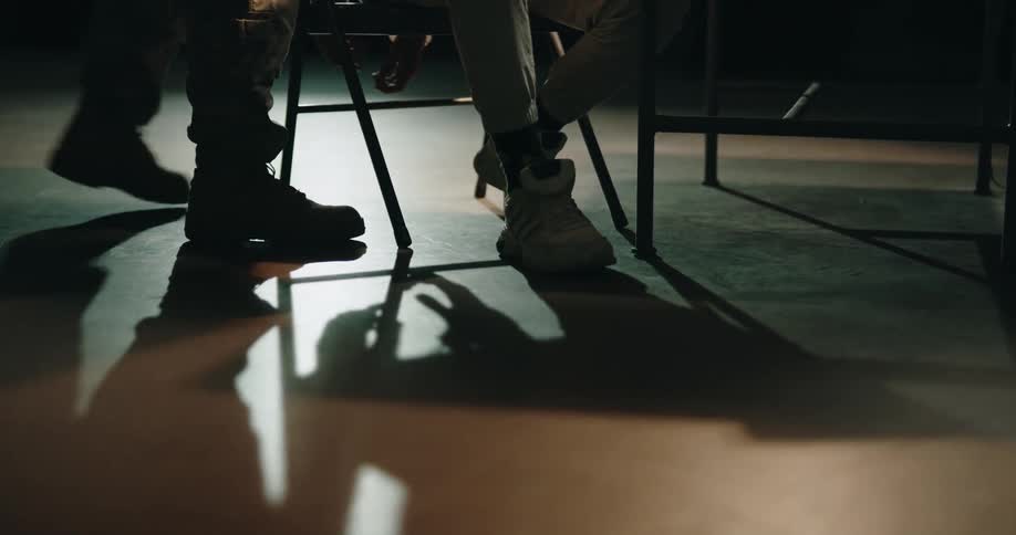 A person walks in the dark room
