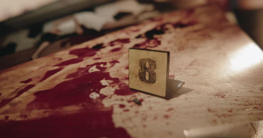 A crime scene photo shows a bloody scene