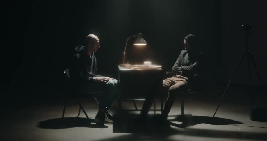 Two friends are talking together in a room
