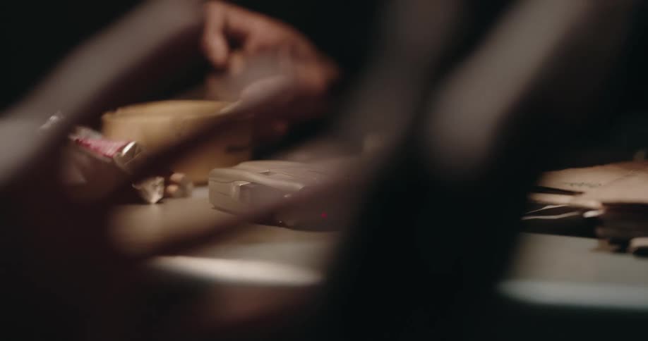 A tape recorder is placed on the table during an interrogation