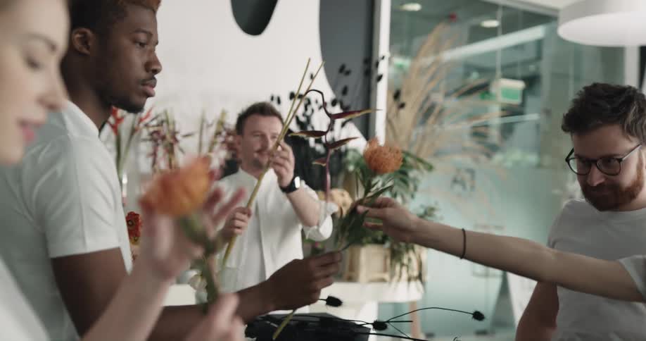 People are arranging flowers in the shop
