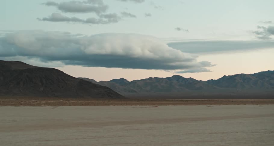Clouds hanging over the mountains in the desert at morning