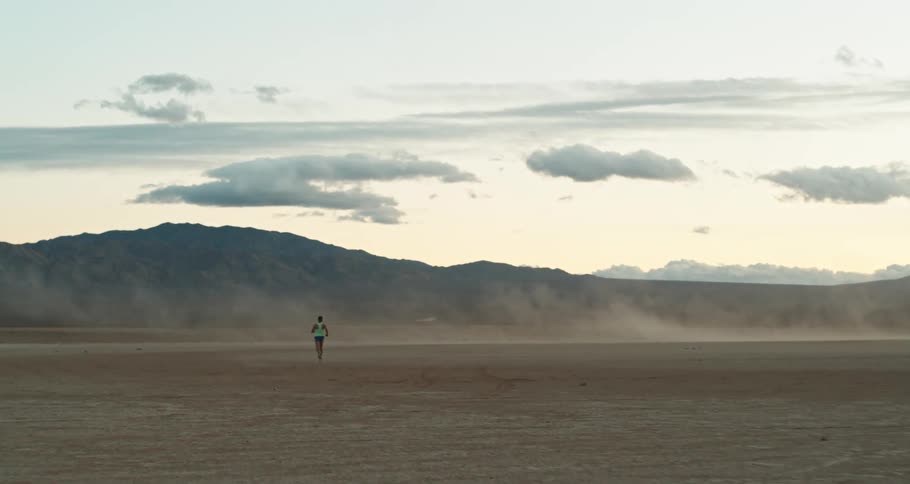 Young person running in the desert