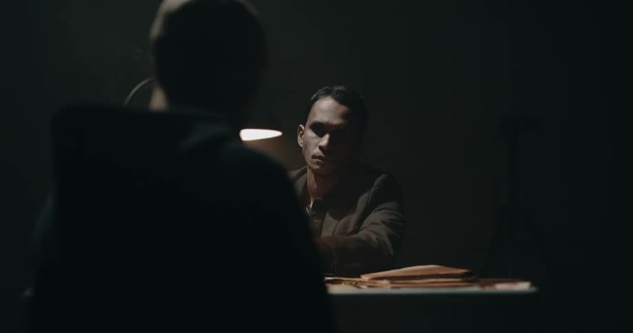 A man is being interrogated by police