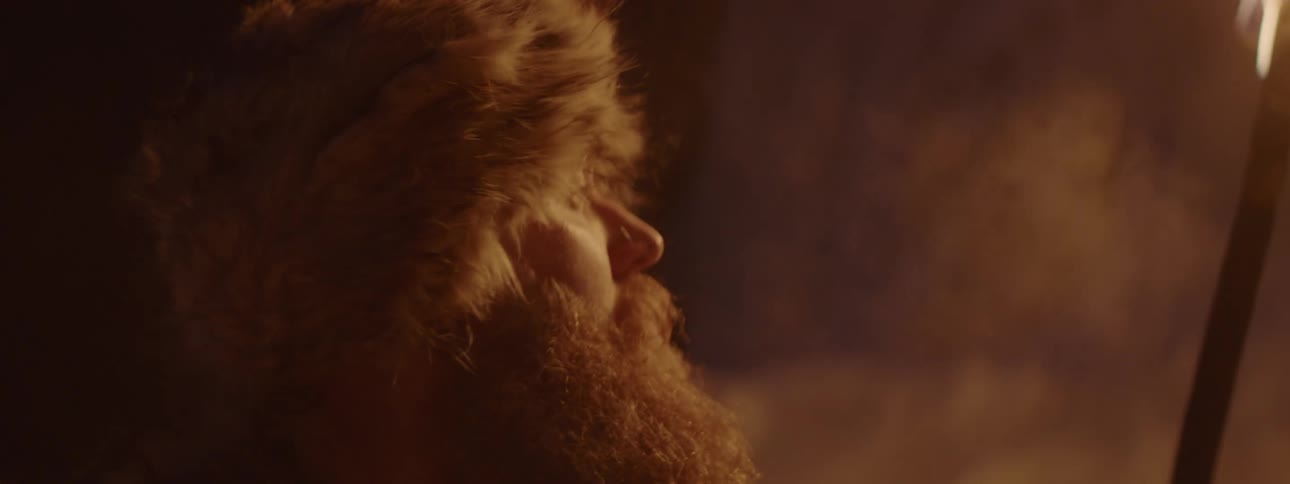 A man is searching around the ice filled cave