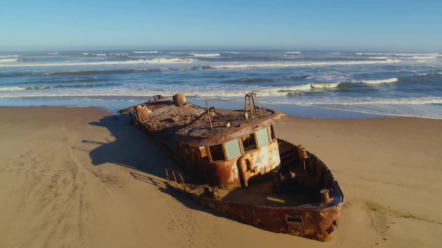 Rusted shipwreck on the Skeleton Coast in Namibian desert