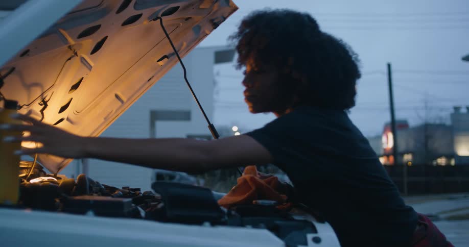 Woman is fixing a vehicle