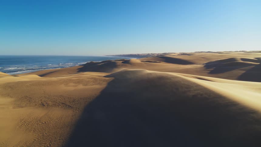 Aerial view of the Skeleton Coast and sand dunes blowing in the wind