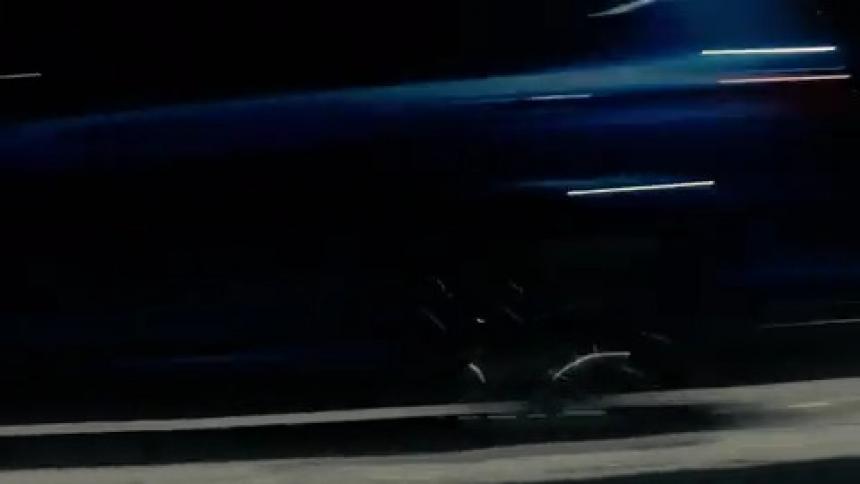 A car is driving on a highway during the night time