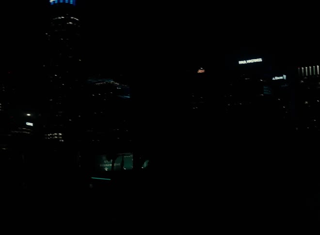 Aerial view of illuminated skyscrapers in the city at night