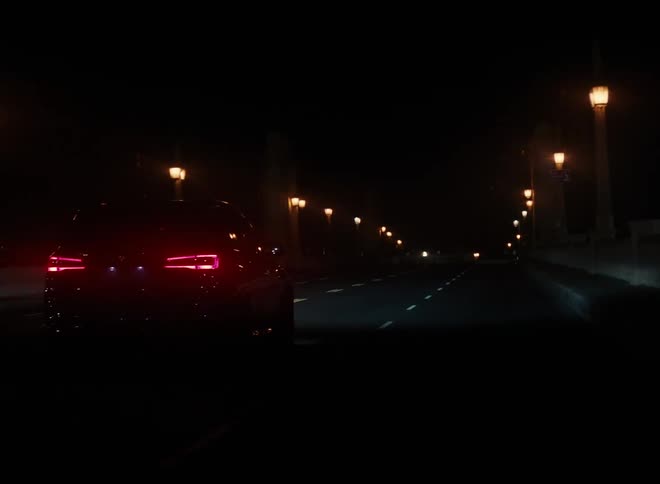Car drives on highway at night
