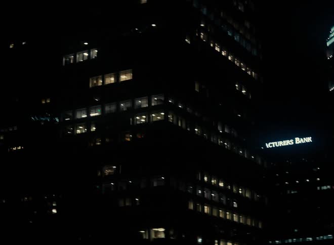 Exterior view of illuminated office buildings in the city at night
