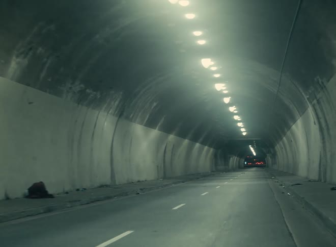 Cars are driving through a tunnel