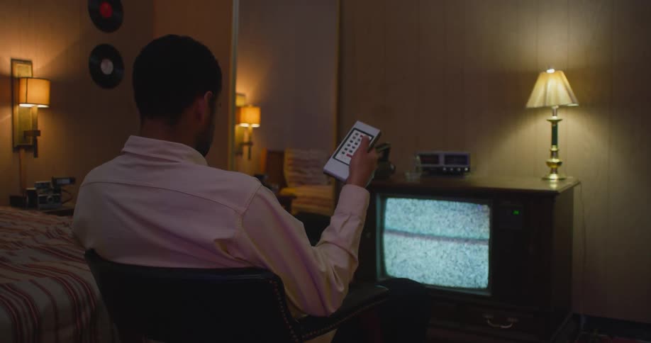 Young teenager is watching some television