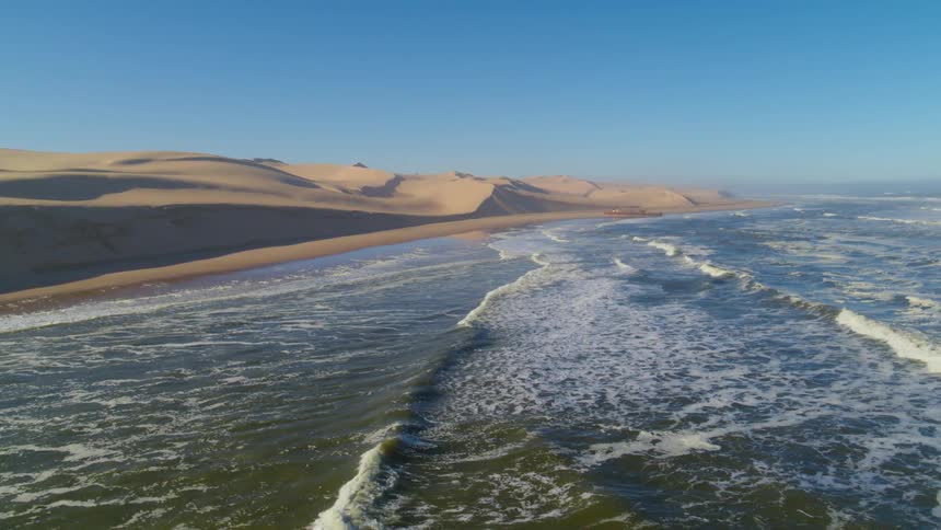 Aerial shot of Namibia's Skeleton Coast with coastline stretching into the distance