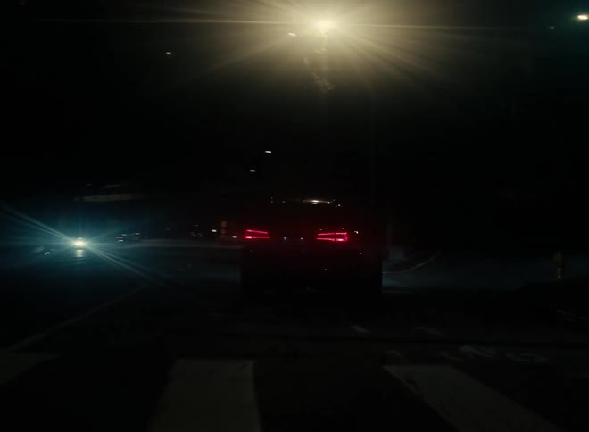 Car drives on highway turning right and accelarates at night