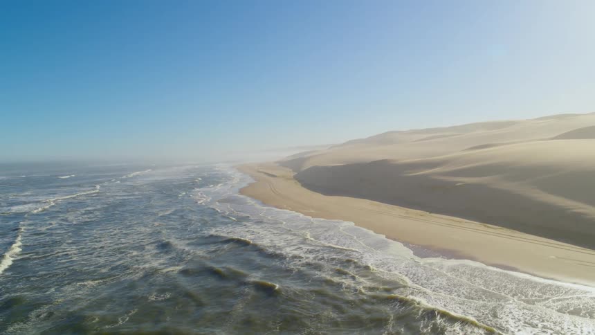 Aerial view of the Skeleton Coast in Namibia where the ocean meets the desert