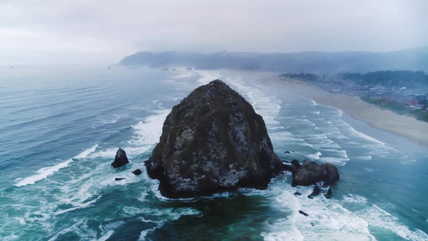 Aerial view of Cannon Beach and Haystack Rock rock formation in Pacific Northwest