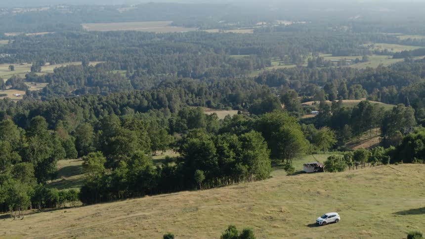The view is of a forest and mountains