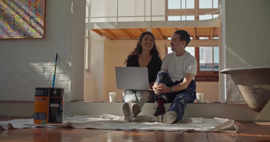 Man and woman are sitting on the floor