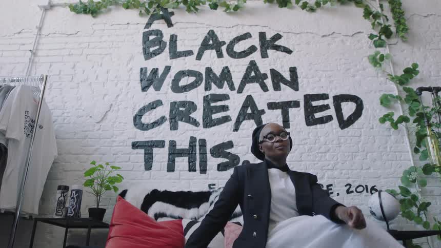 Woman is sitting on a couch