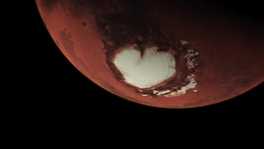 Red planet with white polar cap rotates against darkness of space