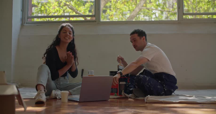 A man and woman sitting in a room