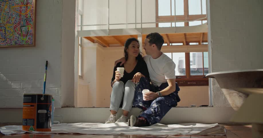 Man and woman are sitting on the floor