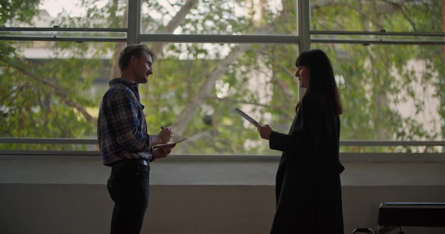 A man and woman talking to each other
