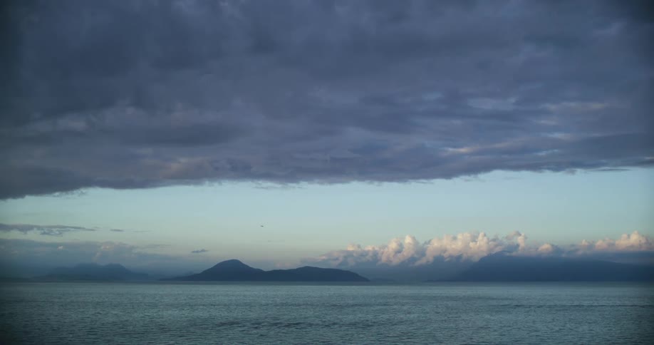 Heavy clouds are over the ocean