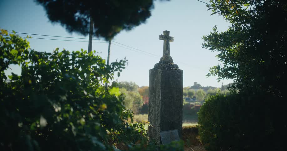 Cross over a pedestal standing on a rural area at daytime
