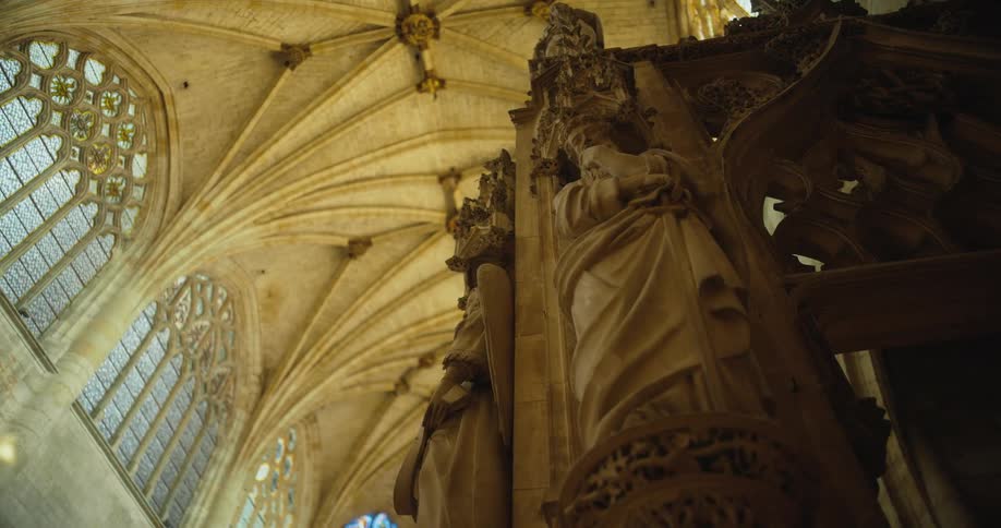 Arches carvings and stained glass windows decorate a gothic church