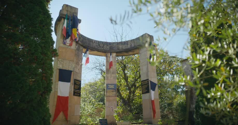 A statue in a park is displayed in spring