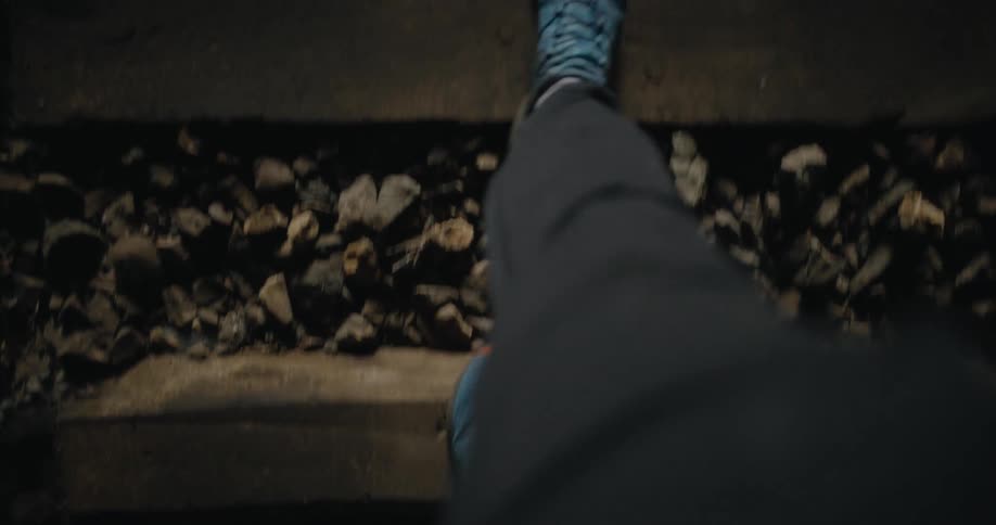 A person is walking outdoors in the wilderness