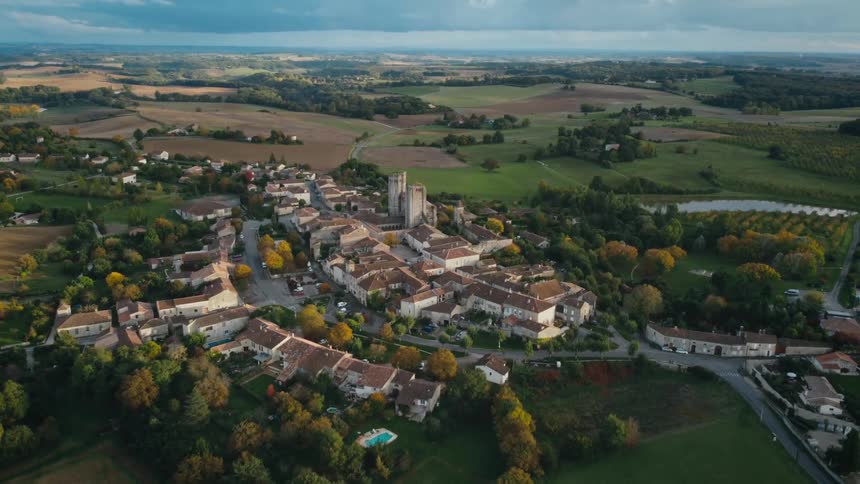 A small town in a hilly countryside during the day