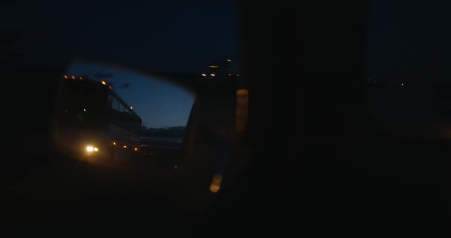 Vehicles travel on the road at night