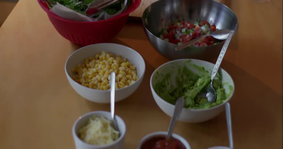 Food in bowls on a kitchen counter