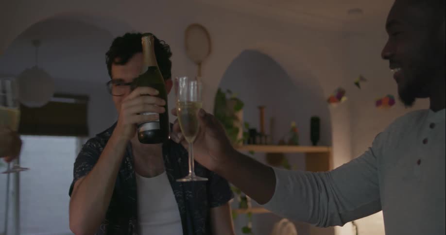 People smile and toast some drinks at a table