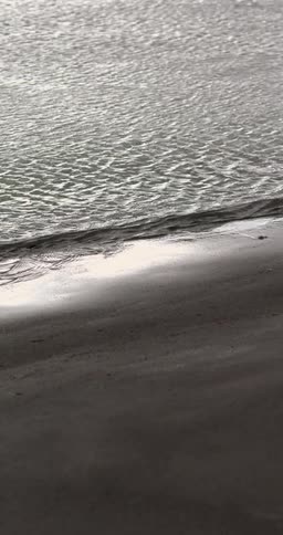 Water flowing on to the beach