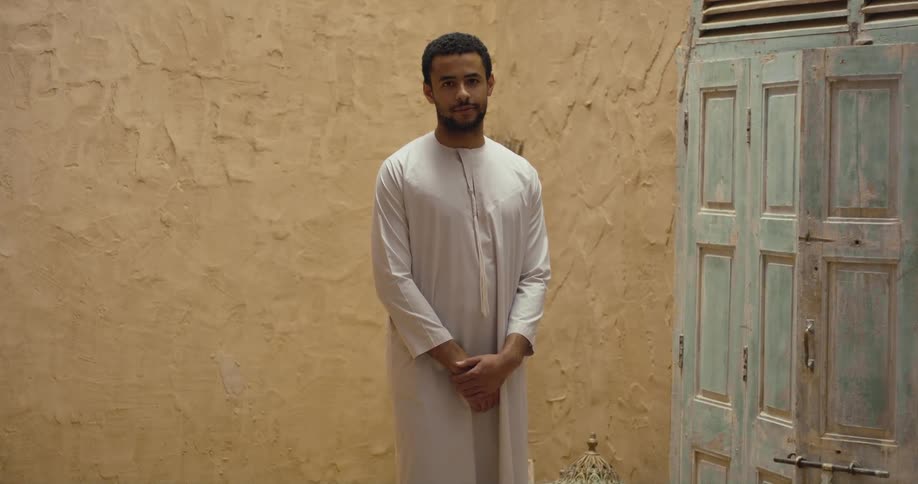 A man is standing near the door