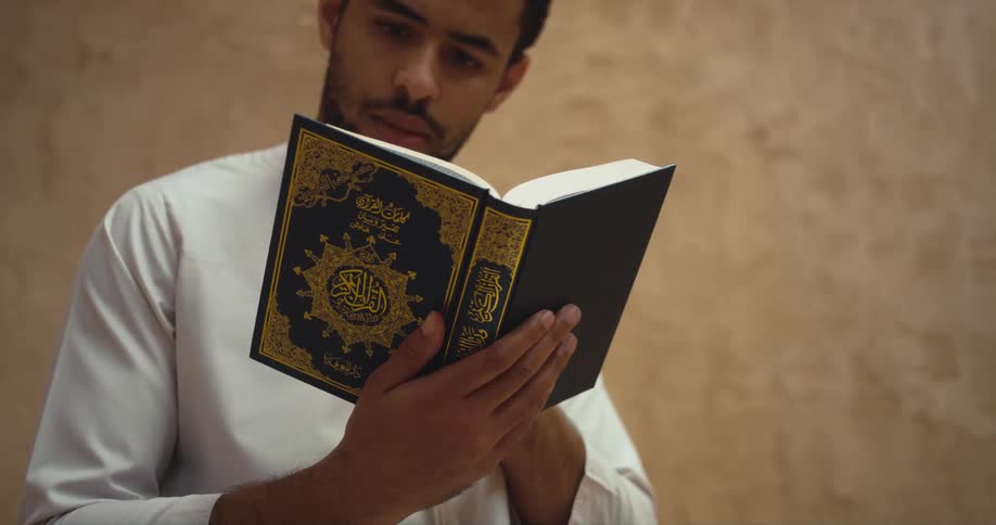 Man reads hardback book